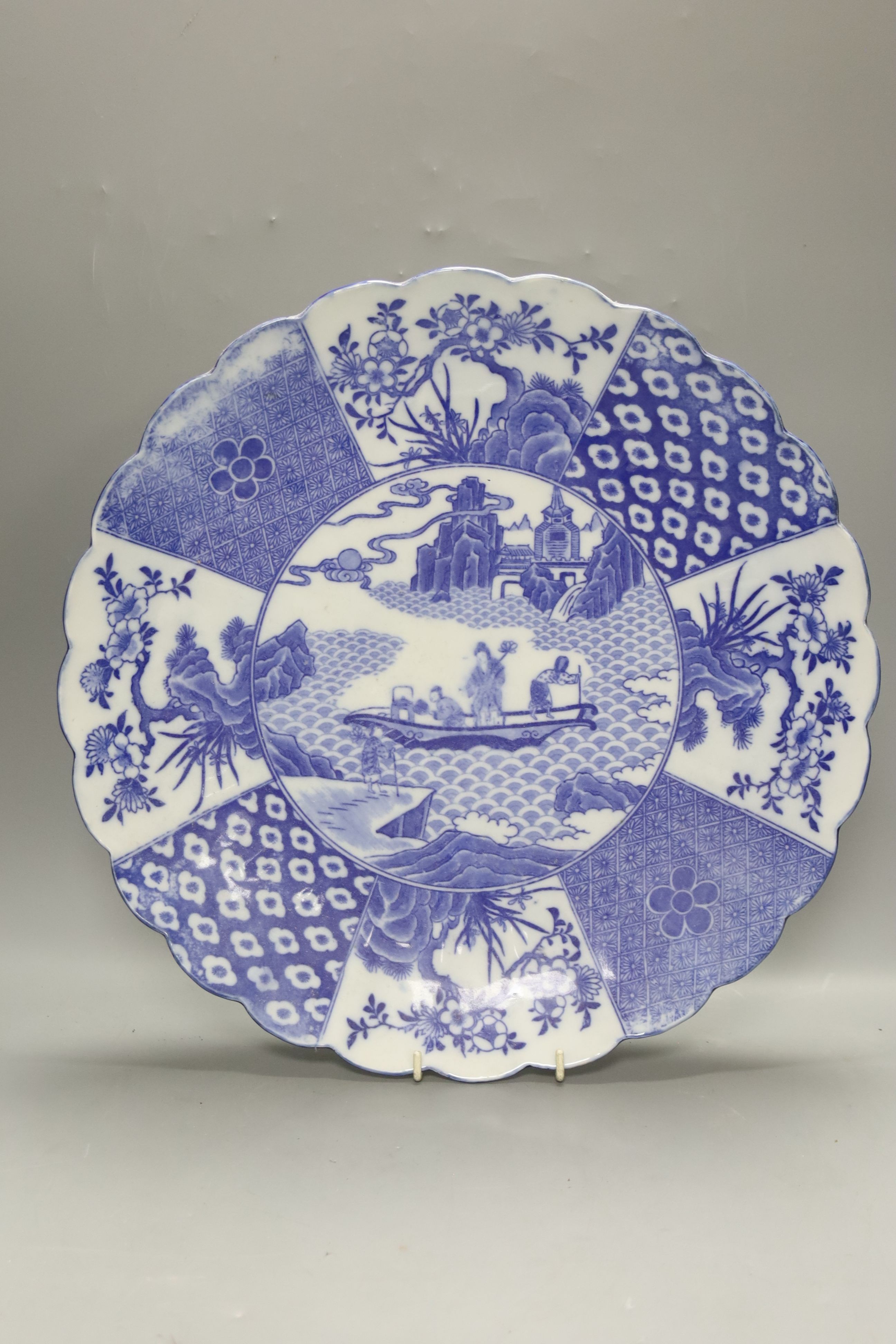 Two Chinese Imari dishes, three Chinese blue and white dishes, a larger Japanese blue and white dish, 5 Japanese blue and white saucer dishes and 2 miniature blue and white jardinieres. 40cm